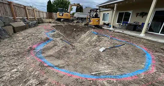 Initial dig of Biodesign pool with outlines marked